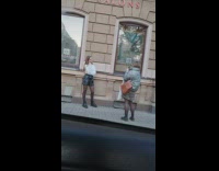 Black shorts girl poses brown building boots