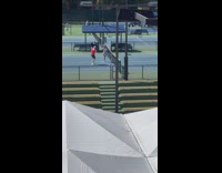 Woman pink hat hold racket tennis court