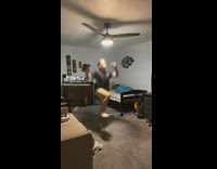 Guy black shirt jumps in room hits head on fan light 