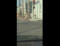 Guy lean on white wall traffic lights