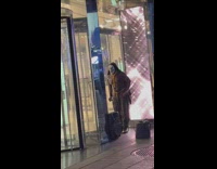 Oiled up shirtless guy in mask doing endless bicep curls