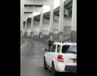 Man drive small scooter on highway road