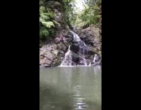 Collab KaleSaladIG - guy stands on rocks next to waterfall falls