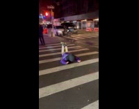 Person doing the worm on crosswalk