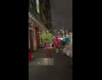 2 people walk in big bow and wings 