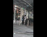 Boyfriend brushes girlfriends long hair in parking lot 