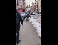 Guy lays back on empty trash can 