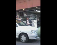 Guy outside restaurant talks to camera car 