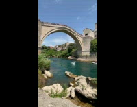 Guy jump from bridge land in river