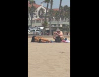 Woman in bikini lie down sideways pose