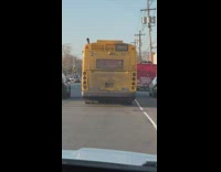 Dusty Bus with Handwritten Text on Rear