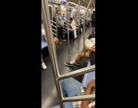 Guy holds free air hugs sign subway 