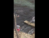 man swims to stone steps video