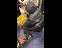 Collab Subway Creatures - Man black jacket sits on train floor