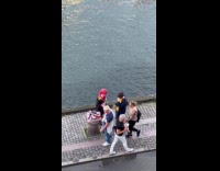 Collab IITW - Woman cosplayer poses for photo beside river