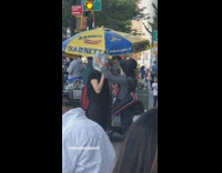 Lady with bag over head removes face mask 