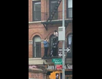 Girl sitting fire stairs building