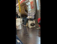 Man pulls down pants naked and wipes butt with napkins on subway train