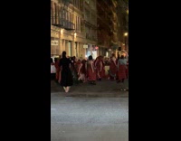 Collab WINY - People wearing red clothing acting dancing on street 