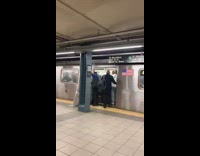 Guy pulls mattress into train 