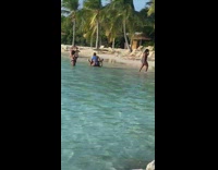 Two woman sit on top chair beach