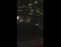 Chucky and Tiffany dolls stick out of car sunroof