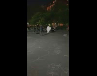 Guy Covered in White Cloth Spins Around 