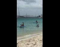 Woman onesie swimsuit sit on paddle board part 2