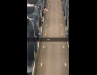 Woman sticks out her bare feet on airplane aisle