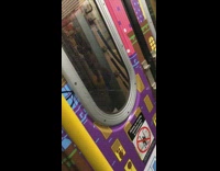 Guy peeing between moving train on subway train