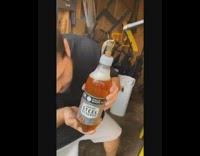 Black shirt guy shotguns beer garage lighter 