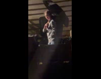 Woman with umbrella in trash bin fell