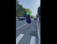 A man dressed a eggplant emoji 