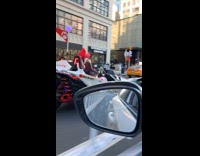 Super Mario drives kart around the city