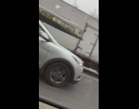 SUV with long canoe on rooftop 