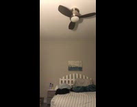 Girl takes grey sweater off with foot