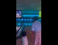 Lady Assists Kid in Bowling and Hits Pins