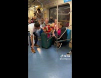 Old woman receives flowers on the train
