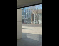 Woman grey pants dance electrocuted move street