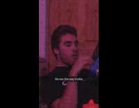 Guy watching movie is facing wrong way 