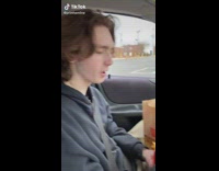Guy in car comparing two french fry sizes the perfect size