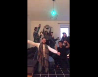Friends start dancing with guy chicken wing