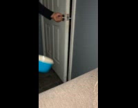 Man throws water at racoon guarding their door 
