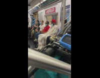 Red hat guy white bedsheets over body 