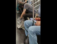 Brown grey kitten sleeps with head up 