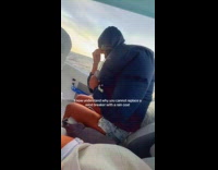 Woman wearing raincoat jacket on speedboat gets inflated 