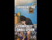 Black beanie guy holds small spoon refrigerator 