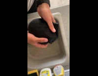 Water appears when guy squeeze wet clothes