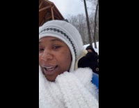 Woman all bundled up for snow 