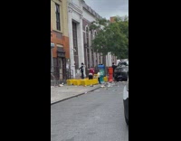 Group of kids play in newspaper trash